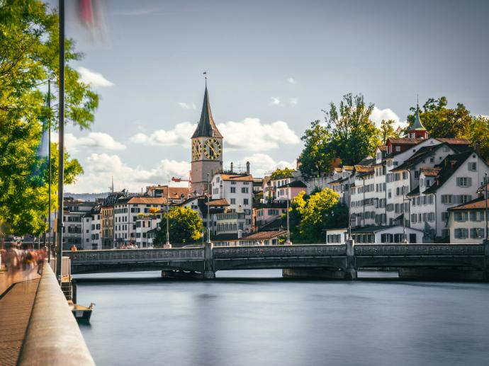 a bridge over a river with buildings on either side of it